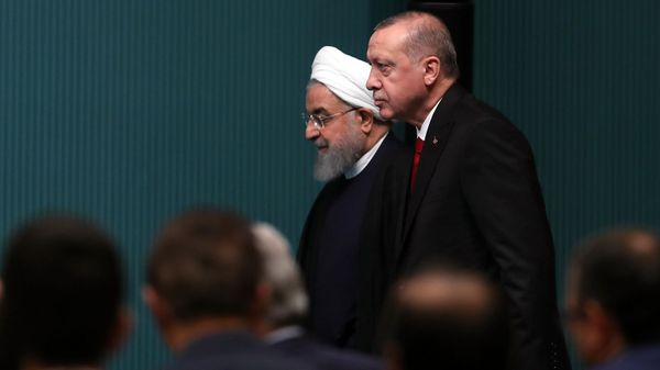 Президенты Ирана и Турции Хасан Роухани и Реджеп Тайип Эрдоган прибывают на совместную пресс-конференцию (20 декабря 2018). Анкара - Sputnik Армения