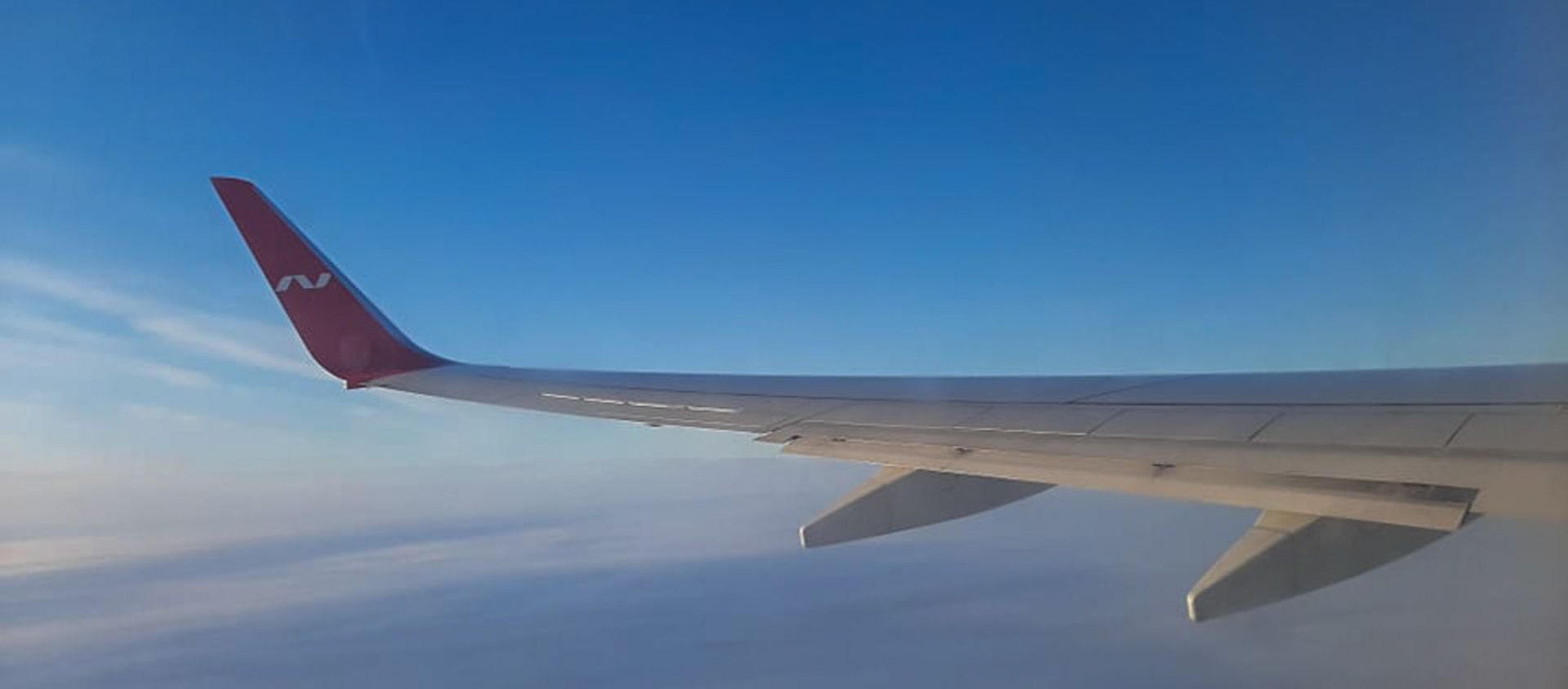 Крыло самолета российской авиакомпании Nordwind Airlines во время полета Крыло самолета российской авиакомпании Nordwind Airlines во время полета - Sputnik Армения, 1920, 21.04.2021