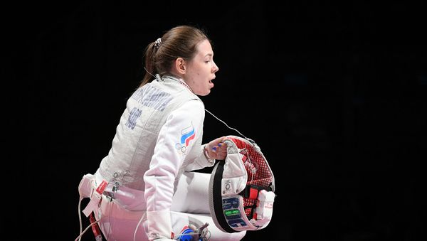 Российская спортсменка, член сборной России по фехтованию Марта Мартьянова в финальном поединке по фехтованию на рапирах во время командного первенства среди женщин на XXXII летних Олимпийских играх (29 июля 2021). Токио - Sputnik Армения