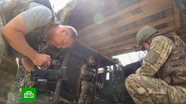 Оператор НТВ Валерий Кожин во время съемок. Архивное фото - Sputnik Армения