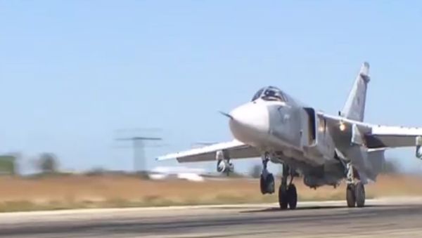 СПУТНИК_Момент сброса бомбы с российского самолета Су-24М на боевом вылете в Сирии - Sputnik Армения